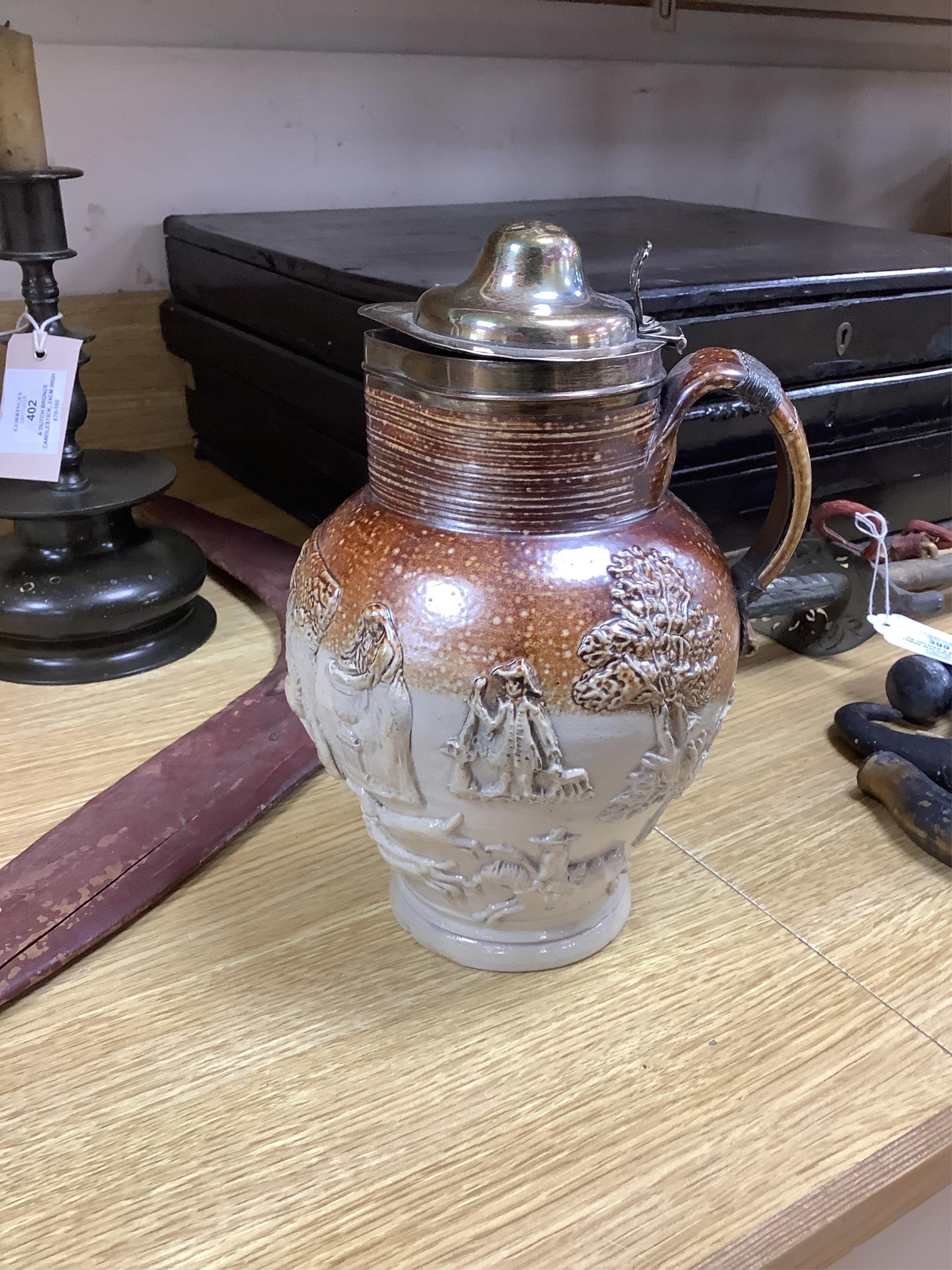 A group of Continental ceramics including two late 18th/early 19th century Italian maiolica wet drug jars, a Staffordshire Whieldon type tortoiseshell glazed plate c.1770 and a silver mounted Mortlake stoneware jug, 24cm